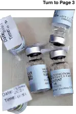  ?? AFP ?? Empty vials of Johnson & Johnson’s COVID vaccine lie on a table as South Africa proceeds with its inoculatio­n campaign on Feb. 18. The US FDA said the J&J jab is highly effective. Story on Page 11.