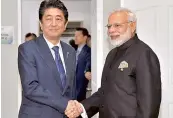  ?? —PTI ?? Prime Minister Narendra Modi with his Japanese counterpar­t Shinzo Abe, in Manila, on Tuesday.