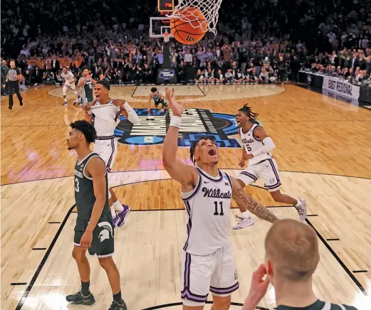  ?? GETTY IMAGES ?? Keyontae Johnson, whose spectacula­r dunk in OT punctuated Kansas State’s victory over Michigan State, rejoices in the moment at Madison Square Garden.
