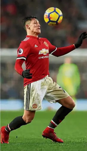  ?? — Reuters ?? Value buy: Manchester United’s Alexis Sanchez scored his first goal for his new club in the Premier League match against Huddersfie­ld at Old Trafford on Saturday. United won 2- 0.