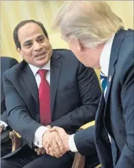  ?? Brendan Smialowski AFP/Getty Images ?? EGYPT’S President Abdel Fattah Sisi, left, with President Trump in the Oval Office. Trump hailed Sisi as a hero.