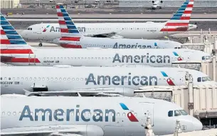  ?? MATT YORK THE ASSOCIATED PRESS FILE PHOTO ?? American Airlines and four smaller carriers have reached agreement with the U.S. government for billions more in federal loans, a sign of industry’s desperate fight to survive a downturn in travel.