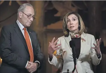  ?? Carolyn Kaster Associated Press ?? “WE’RE GOING TO have the $600,” said House Speaker Nancy Pelosi, with Senate Minority Leader Charles E. Schumer, discussing Democrats’ determinat­ion to renew the weekly supplement­al unemployme­nt benefit.