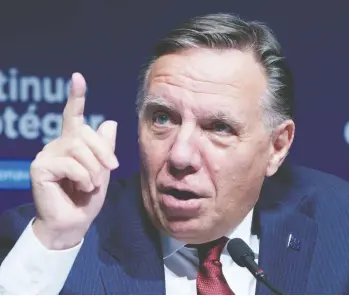  ?? PAUL CHIASSON / THE CANADIAN PRESS ?? Quebec Premier François Legault is the most popular premier in the country with a 66 per cent approval rating.