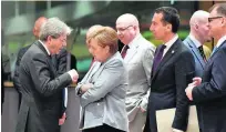  ?? Martin Meissner / AP Photo ?? From left, Italian prime minister Paolo Gentiloni, German chancellor Angela Merkel and Austrian chancellor Christian Kern at the EU summit in Brussels yesterday.