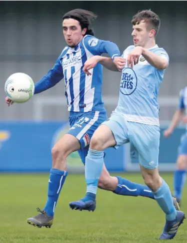  ??  ?? Tight tussle: Warrenpoin­t’s Kris Cowan battles with Coleraine’s Jamie Glackin