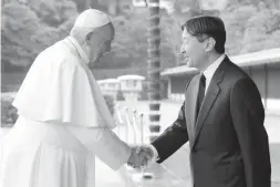  ??  ?? THE POPE AND THE EMPEROR – Pope Francis shakes hands with Japan’s Emperor Naruhito on his arrival at the Imperial Oalace in Tokyo, Monday, Nov. 25, 2019. (AP)