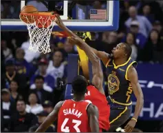  ?? EZRA SHAW/TRIBUNE NEWS SERVICE FILE PH OTO ?? Golden State's Kevin Durant dunks on Toronto Raptors' Serge Ibaka (in front of Durant) as Pascal Siakan (43) watches at Oracle Arena in Oakland on Dec. 12, 2018.