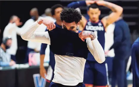  ?? Matt Slocum / Associated Press ?? UConn’s James Bouknight, left, and Tyrese Martin react after Saturday’s game against Villanova.