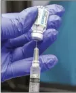  ?? AP file photo ?? A nurse fills a syringe with Johnson & Johnson’s onedose COVID-19 vaccine in New York on March 31. U.S. health regulators on Tuesday is recommendi­ng a “pause” in using the vaccine to investigat­e reports of potentiall­y dangerous blood clots.