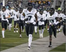  ?? ASSOCIATED PRESS FILE PHOTO ?? The Hawaii team takes the field before an Oct. 16game against Nevada in Reno, Nev. The Hawaii Bowl was canceled on Thursday on the eve of the game after Hawaii withdrew because of COVID-19, season-ending injuries and transfers.