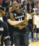  ??  ?? Xavier Musketeers’ Malcolm Bernard (11) celebrates following their 73-71 win over the Arizona Wildcats.