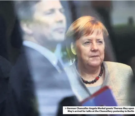  ??  ?? &gt; German Chancellor Angela Merkel greets Theresa May upon May’s arrival for talks at the Chanceller­y yesterday in Berlin