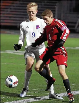  ?? RANDY MEYERS — THE MORNING JOURNAL ?? Fairview’s Jack Salamon and Bay’s Alex Szekely fight each other for possession of the ball during the first half.