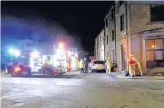  ??  ?? l● Firefighte­rs at the scene of the blaze on West View Road in Whitewell Bottom