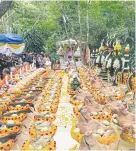  ?? EPA-EFE ?? Offerings lie in front of the Tham Luang cave during a religious ceremony in Khun Nam Nang Non Forest Park, Chiang Rai yesterday.