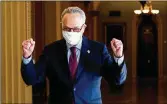  ?? ERIN SCHAFF / NEW YORK TIMES ?? Senate Majority Leader Chuck Schumer (D-N.Y.) celebrates after the passage of a $1.9 trillion COVID relief bill Saturday.