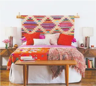  ?? CB2.COM ?? Hanging a rug as a headboard is an alternativ­e way to reuse an area rug. Panja Rug, CB2.