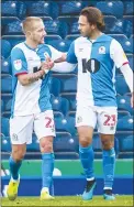  ??  ?? YES: Lewis Holtby, left, celebrates with Bradley Dack