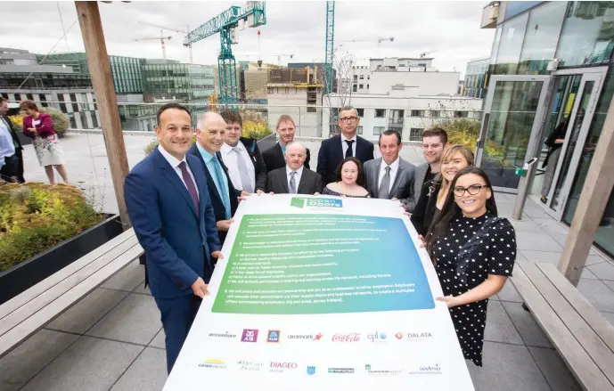  ??  ?? Sodexo employee Mossie O’Donovan (fifth from left) with An Taoiseach Leo Varadkar at the launch of the Open Doors initiative