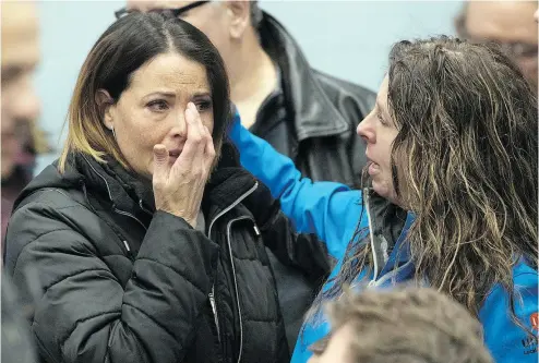  ?? LARS HAGBERG / AFP / GETTY IMAGES ?? A union member cries before the press conference with union leaders in Oshawa, Ont. Monday. General Motors announced Monday it will close the plant in Oshawa, putting about 2,500 people out of work.