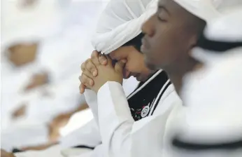  ??  ?? Emotion overtakes a young Emirati during the Commemorat­ion Day event