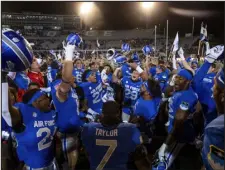  ?? PARKER SEIBOLD — THE GAZETTE VIA AP ?? Air Force celebrates its win over Wyoming on Saturday at the Air Force Academy in Colorado Springs.