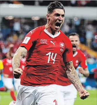  ?? KEVIN C. COX
GETTY IMAGES ?? Steven Zuber of Switzerlan­d celebrates after scoring his team’s goal during the 2018 FIFA World Cup Russia group E match against Brazil at Rostov Arena on Sunday in Rostov-on-Don, Russia.