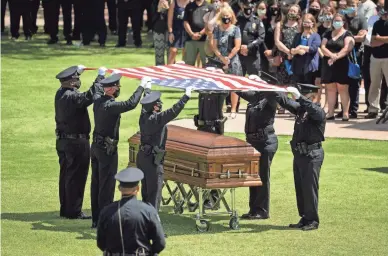  ??  ?? A funeral service for Officer Jason Judd is held at Christ’s Church of the Valley in Peoria.