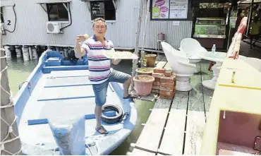  ??  ?? Soza Syahrimy Zainol says he has heard about new job opportunit­ies for the southern fishermen. However, he still wants to remain at sea. — WAN MOHIZAN WAN HUSSEIN/ The StarChew Seng San of Chew Jetty was formerly a stevedore whose job became obsolete. He now sells durian puffs. — ASRI ABDUL GHANI/ The Star