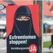  ?? AFP ?? A campaign poster, in favour of the “burqa ban” initiative.