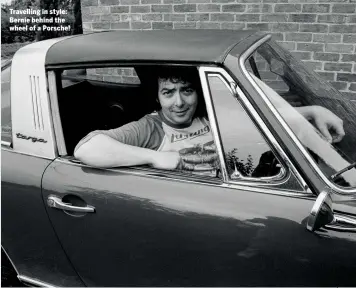  ??  ?? Travelling in style: Bernie behind the wheel of a Porsche! Bernie used a Watkins Dominator amp in his formative years