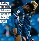  ??  ?? Feeling the pain: Saka was forced off through injury