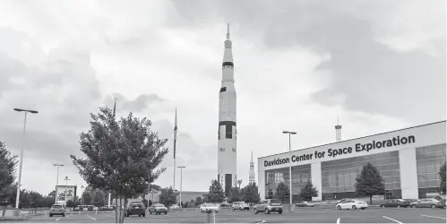  ??  ?? ■ TOP: A replica Saturn V rocket can be seen July 13 at the U.S. Space and Rocket Center in Huntsville, Ala. Inside the neighborin­g Davidson Center for Space Exploratio­n building, a Saturn V is hung for display in sections for visitors to examine....