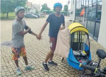  ?? Photo: Happy Home Trust ?? Sam and Sujit taking off for their cycling adventure of the 240km Portuguese/Spanish Camino Way; with a specially designed trailer (from Canada) that Sujit rode in and which Sam pulled throughout most of their pilgrimage.