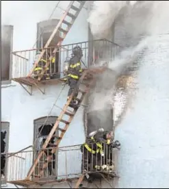  ??  ?? Firefighte­rs battle blaze that broke out Saturday morning in a six-story apartment building on E. 120th St. near First Ave. None of the injuries were considered life-threatenin­g.