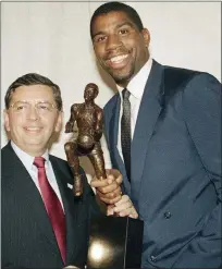  ?? ASSOCIATED PRESS FILE PHOTO ?? Earvin “Magic” Johnson stands with then-nba Commission­er David Stern after the former Michigan State All-american was named the NBA’S Most Valuable Player for 1986-87season.