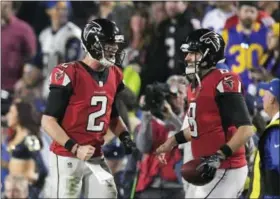  ?? MARK J. TERRILL — THE ASSOCIATED PRESS ?? Atlanta Falcons quarterbac­k Matt Ryan, left, celebrates with backup quarterbac­k Matt Schaub after the throwing a touchdown pass in the second half during an NFL football wild-card playoff game against the Los Angeles Rams, Saturday in Los Angeles.