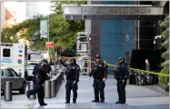  ??  ?? AP PHOTO BY RICHARD DREW New York City Police Dept. officers arrive outside the Time Warner Center, in New York, Wednesday, Oct. 24.