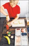  ?? KATIE WORKMAN VIA AP ?? This 2015 photo provided by Katie Workman shows her son Charlie Freilich working in the kitchen at his home in New York.
