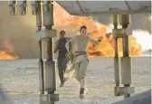  ?? DAVID JAMES/DISNEY/LUCASFILM ?? Daisy Ridley as Rey and John Boyega as Finn in “Star Wars: The Force Awakens.”