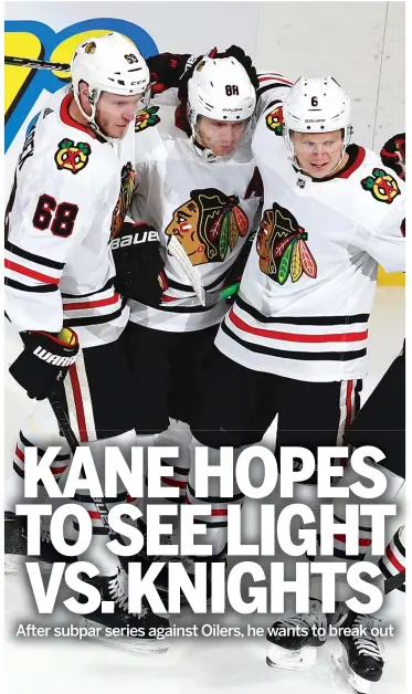  ?? JEFF VINNICK/GETTY IMAGES ?? Patrick Kane (center) had only one goal in the qualificat­ion series against the Oilers.