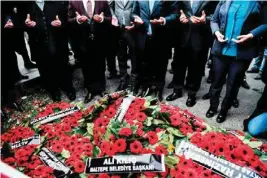  ??  ?? Mayors of the main opposition Peoples Republic Party (CHP) pray after laying wreaths in front of the Reina nightclub in Istanbul on January 4, 2017, three days after a gunman killed 39 people there on New Year’s eve