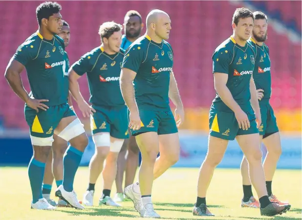 ?? Picture: GETTY IMAGES ?? FRONTING UP: Skipper Stephen Moore leads the team during the Australian Wallabies Captain's Run at Suncorp Stadium yesterday.