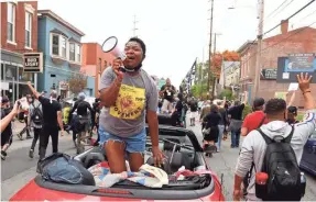  ?? BAILEY LOOSEMORE/USA TODAY NETWORK ?? Sadiqa Reynolds, CEO of the Louisville Urban League, leads chants during a march for Breonna Taylor on Oct. 10.