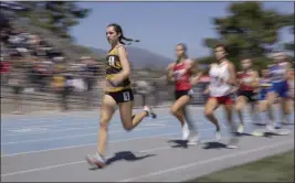  ?? PHOTO BY DREW A. KELLEY ?? Peninsula's Aishling Callanan, shown running in the CIF-SS prelims last season, finished first in the 1,600at the Redondo Nike Track Festival on Saturday.