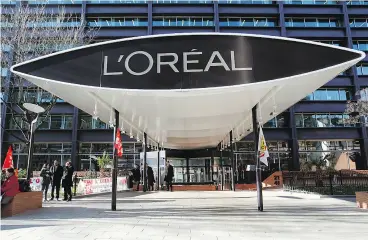  ?? THOMAS SAMSON / AFP / GETTY IMAGES ?? L’Oreal, the highest-ranked gender- diverse company, scored 22 points out of 35.