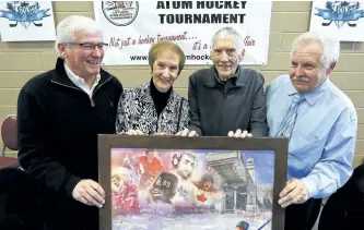  ?? CLIFFORD SKARSTEDT/EXAMINER ?? Guest speaker former NHLer Doug Gibson, from left, with only living founding member of original tournament committee Howie Eastman and his wife Mary, as well as former chairman Steve Casey at the 60th anniversar­y Peterborou­gh Liftlock Atom Hockey...