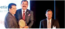  ??  ?? DFCC Bank CEO Lakshman Silva receiving the Merit award for ‘Category-one: Human Capital Management for Building a Cohesive Value-based Internal Culture’ from ADFIAP Chairman Shivjee Roy Yadav at the 41st Annual Meeting of ADFIAP