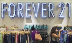  ?? — Reuters ?? Women shop for clothes in clothing retail store Forever 21 in New York.